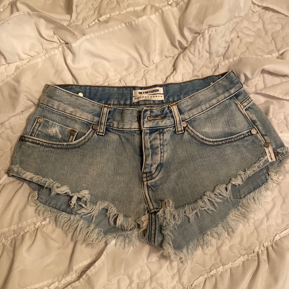 One x One Teaspoon no 2’s low waist, short rise light wash denim shorts size 23